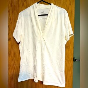 Cream colored V-Neck top.